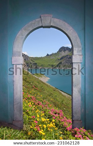 view through arched door; artificial lake, alpine flowers and mountains