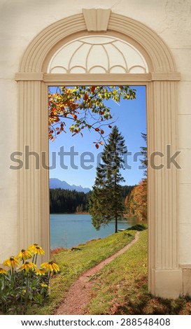 view through arched door, autumnal hiking trail at alpine lakeside