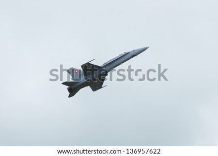 RAF WADDINGTON, UNITED KINGDOM - CIRCA 2012 - Swiss Air Force F18 Hornet performs low speed high angle of attack fly past at the annual international airshow at RAF Waddington Circa 2012.