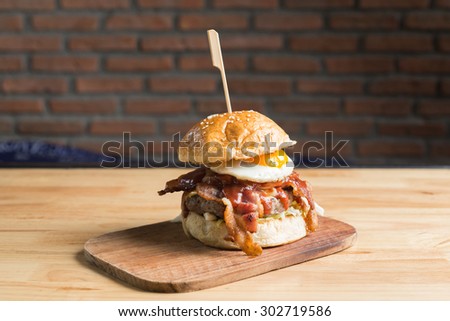 Big bacon and beef steak burger with fried egg