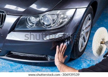 Car polishing series : A man waxing grey car