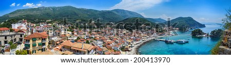 Panoramic view of traditional Greek houses, mountains, islands and Ionian Sea in Parga, Greece.