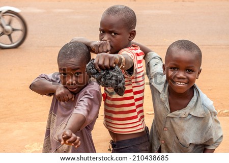 Central African Republic-July 17 unidentified kids posing as boxers at streets of Bangui on July 17, 2014 in Bangui, Central African Republic