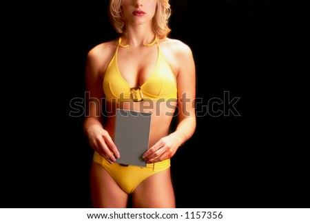 Sexy Model holds up blank gray Card which could be used for Numbers or Text