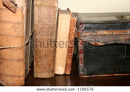 Old English History Books and  leather saftey box on desk