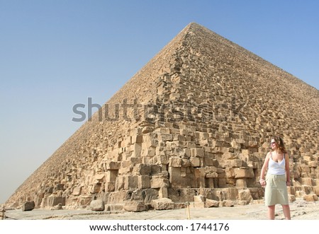 Attractive smilling young Holiday Maker looks out from Pyramisover Cairo