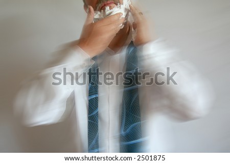 Foaming Businessman running late for work with Motion Blur