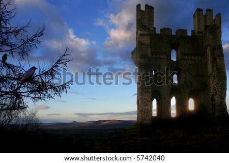 Scottish Haunted Tower at Dusk with rolling Hills in background, glowing shafts of light through lower windows and Crows nesting in turret and in Fir Tree in forground
