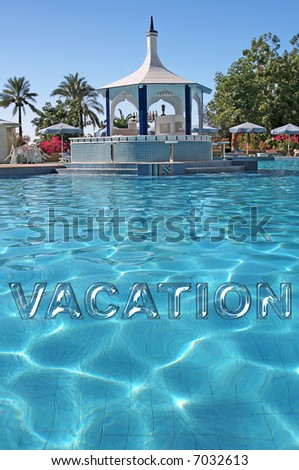 Vacation Text in liquid effect on Water against a stunning luxury Pool Area with Water Bar