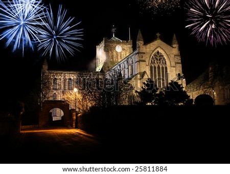 New hope on the stroke of Midnight shown on Abbey Clock as fireworks light the night sky. With room for text in foreground