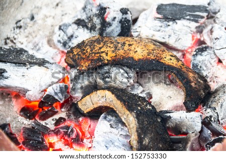 Cow skin burned on charcoal.