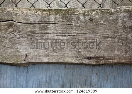 weathered wooden board with nails, close-up