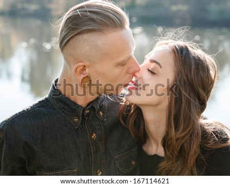 young male and female kissing