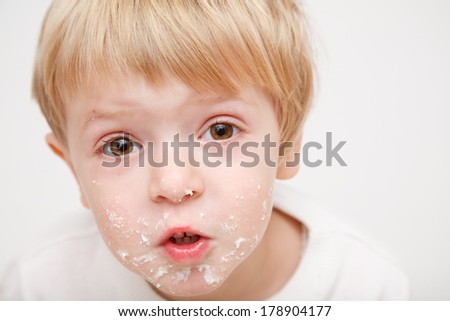 little girl with dirty face closeup on white background