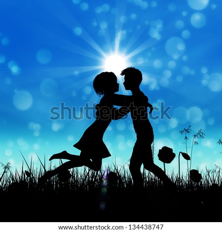 Black silhouette of young couple embracing on summer meadow.