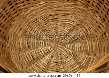 Brown wicker wooden basket as background, macro photo.