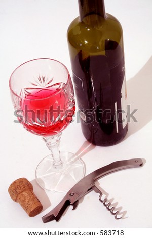 Opened bottle with a glass of wine