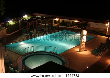 A swimming pool by night