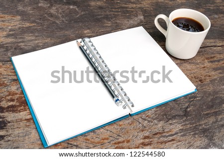 Open blank note book with coffee cup on grunge wood