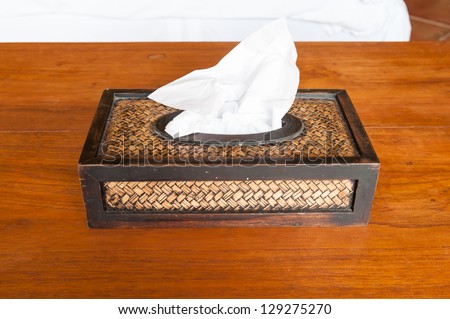 Tissue paper box made by basketry bamboo on wooden table