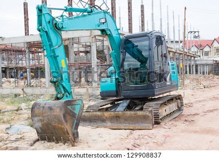 Land excavators green on construction site