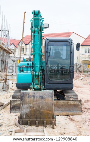 Land excavators green on construction site