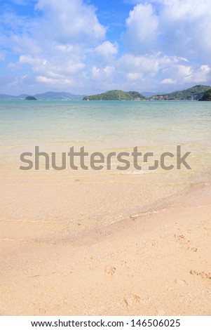 Tropical beach with blue ocean and blue sky