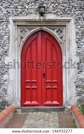 Red Gothic church door, Alresford, Hampshire, England, UK