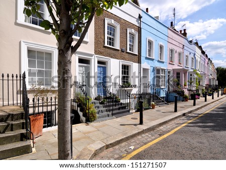 London street of terraced houses without parked cars.