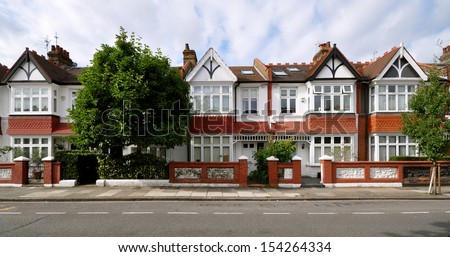London street of early 20th century Edwardian terraced houses without parked cars London street of early 20th century Edwardian terraced houses without parked cars