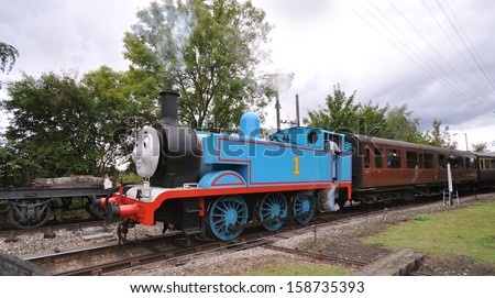 DIDCOT, UK - OCTOBER 5. Thomas the Tank Engine is a live steam engine, based on books for children by Rev Wilbert Awdry, running on October 5, 2013 running at Didcot Railway Centre, Oxfordshire, UK.