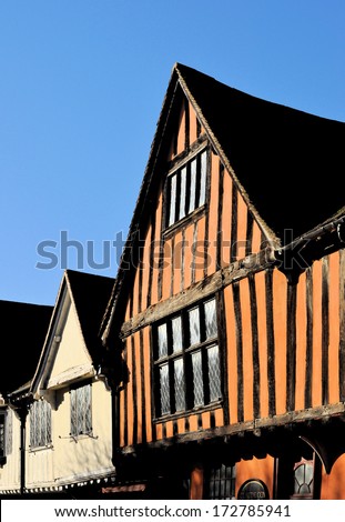 Upper facades of 17th century medieval street of timber framed houses in Ipswich, England, UK.