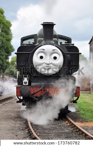 DIDCOT, UK -Ã?Â OCTOBER 5. A live steam locomotive bearing the face of Thomas the Tank Engine based on stories by Wilbert Awdry, running on October 5, 2013 at Didcot Railway Centre, Oxfordshire, UK.