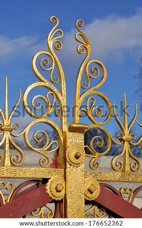 British Victorian period decorative wrought iron gilded railings finial in London, c1875.