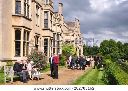 RUSHTON, UK - JUNE 27. A reception at Rushton Hall on June 27, 2014, a country house dating from 1438 with additions over the centuries, now an events venue and hotel at Rushton, Northamptonshire, UK.