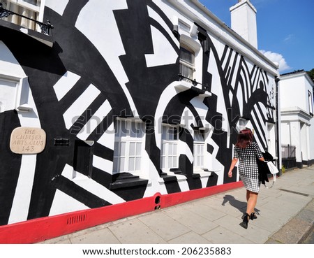 LONDON - JULY 1. The facade of Chelsea Arts Club on July 1, 2014; a temporary tribute to the World War One British and USA artists who painted ships in Dazzle Camouflage, located in Chelsea, London.