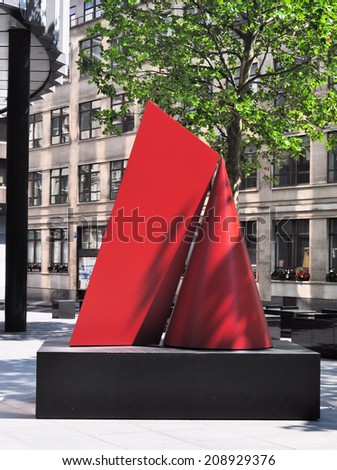 LONDON - JULY 26. Kiss is the title of the red painted steel sculpture by artist Nigel Hall on July 26, 2014, on temporary exhibition at Fenchurch Avenue in the financial district of London, UK.