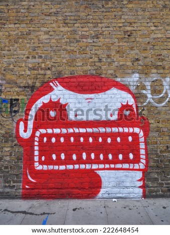 LONDON - SEPTEMBER 27. Street art painted on old brick wall on September 27, 2014 in Hanbury Street in east London, UK.