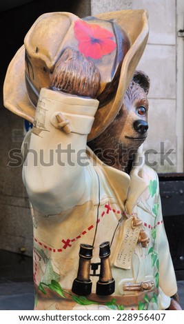 LONDON - NOVEMBER 4. A decorated street model of Michael Bond\'s fictional character Paddington Bear, on November 4, 2014, for later charity auction; one of 50 designs located across London.