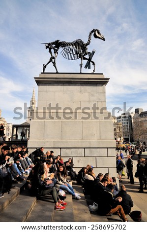 LONDON - MARCH 6, 2015. Hans Haacke's Gift Horse statue has an electronic ribbon displaying the Stock Exchange live ticker on temporary display on the fourth plinth in Trafalgar Square, London.