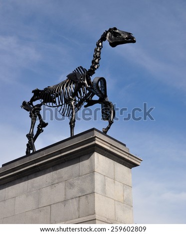 LONDON - MARCH 6, 2015. Hans Haacke\'s Gift Horse statue has an electronic ribbon displaying the Stock Exchange live ticker on temporary display on the fourth plinth in Trafalgar Square, London.