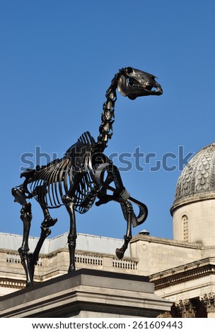 LONDON - MARCH 6, 2015. Hans Haacke\'s Gift Horse statue has an electronic ribbon displaying the Stock Exchange live ticker on temporary display on the fourth plinth in Trafalgar Square, London.