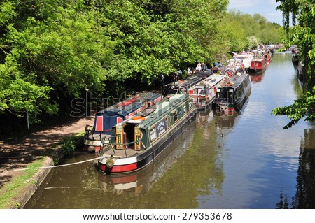 RICKMANSWORTH, UK - MAY 16, 2015. Narrow boats moor along the Grand Union Canal for the annual town festival at Rickmansworth, a small town in the county of Hertfordshire, England, UK.