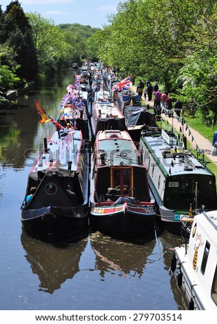 RICKMANSWORTH, UK - MAY 16, 2015. Narrow boats moor along the Grand Union Canal for the annual town festival at Rickmansworth, a small town in the county of Hertfordshire, England, UK.