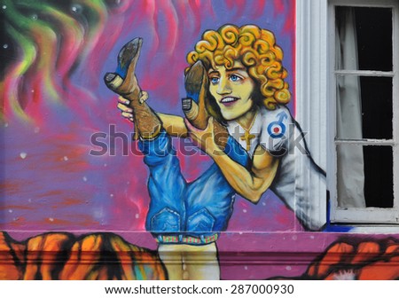 LONDON - JUNE 6, 2015. Temporary painted and printed mural by artist Morganico on the Old Church Street facade of the Chelsea Arts Club in the Royal Borough of Kensington and Chelsea, London, UK.