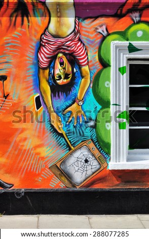 LONDON - JUNE 6, 2015. Part of a temporary spray painted mural by artist Morganico on the Old Church Street facade of the Chelsea Arts Club in the Royal Borough of Kensington and Chelsea, London, UK.
