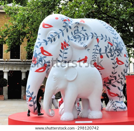 LONDON - JUNE 26, 2015. A decorated 10 feet model elephant with its baby is the subject of a design competition to save the Asian Elephant from extinction, located at Duke of York Square, London, UK.