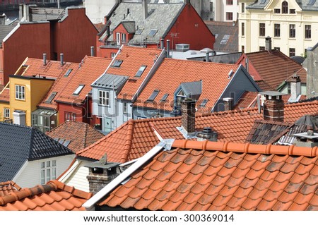BERGEN, NORWAY - JULY 3, 2010. Tiled roof tops of houses over the ancient city of Bergen, Norway.
