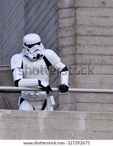 LONDON - OCTOBER 4, 2015.  A Stormtrooper, the fictional character from Stars Wars, poses at the National Theatre, the 1977 Brutalist building located at the Southbank, London, UK.