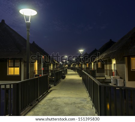 The walk way of water chalet at night